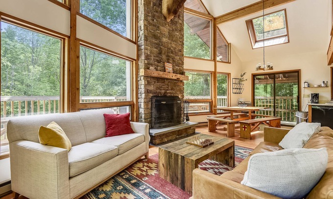 West Bridgewater Ski Chalet | Northeast Passage Chalet is a cozy and warm. Wonderful hot tub on the deck and a great big stone fireplace.