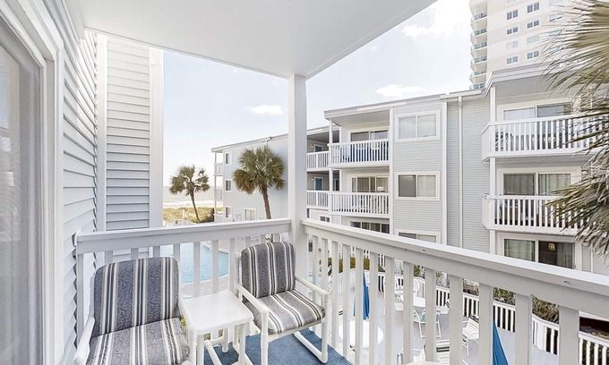 Crescent Beach Condo | Ocean-view condo near beach and golf with pool, balcony, central AC, & W/D