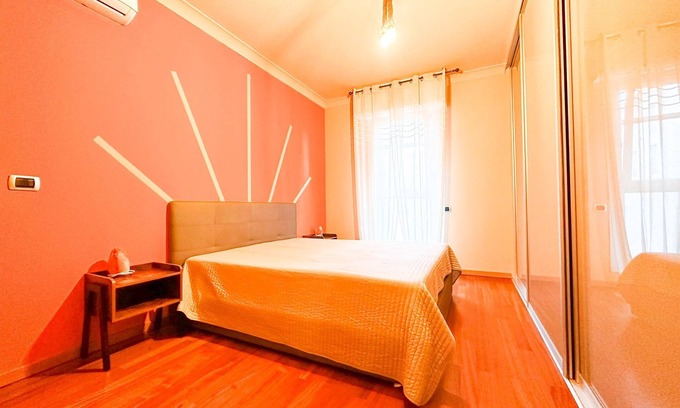 Rivoltella House | ORANGE ROOM WITH GARDEN VIEW