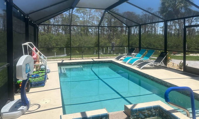 Englewood South House | Outdoor paradise on waterway with pool and spa, beach gear, and dog friendly