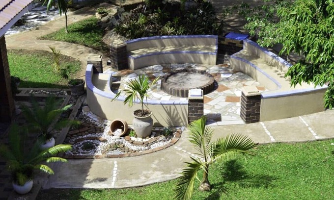 Kwekwe House | Palm and rose garden, golden acres