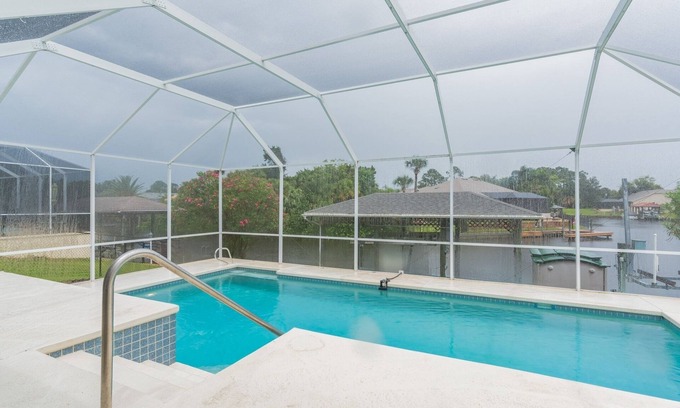 Palm Harbor House | Peaceful Waterfront Pool Home by RedAwning