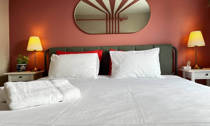 Downtown Apartment | Pink Sunrise: Energetic Studio, Bold Decor