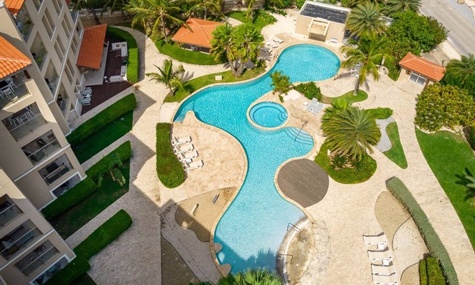 Oranjestad-West Condo | Pool view, gym 2BR/2BA Condo Steps from Eagle Beach