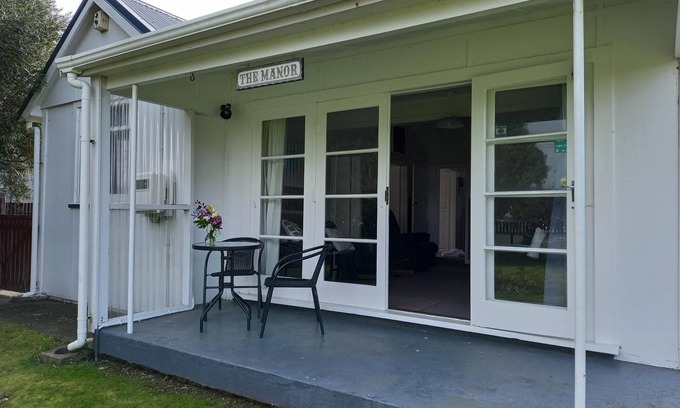 Foxton Beach House | Quaint comfortable convenient well appointed family bach.