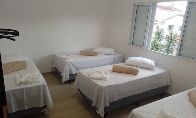 Paraisopolis Apartment | Quarto Família Superior na Pousada Verissimus