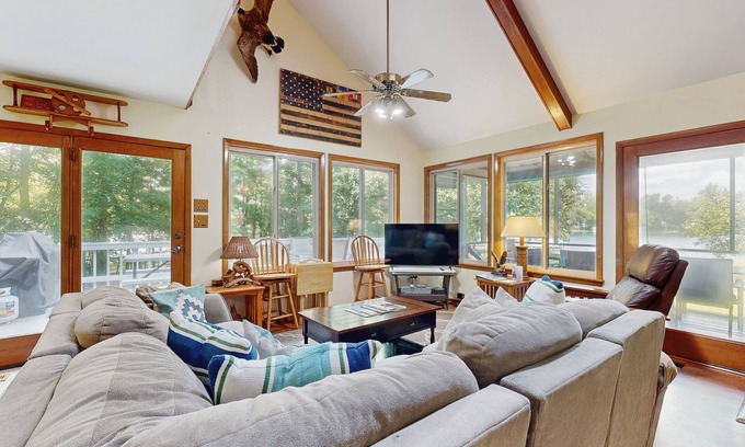 Bumpass House | Relaxing lakeside retreat with boathouse, dock, deck, firepit and screened porch