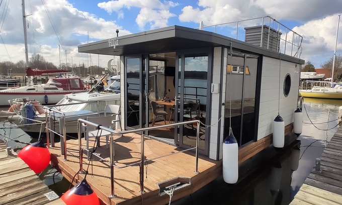 Schleswig Boat Rental | Relaxing vacation on houseboat Hilja with a great view of the Schlei (dog-friendly)