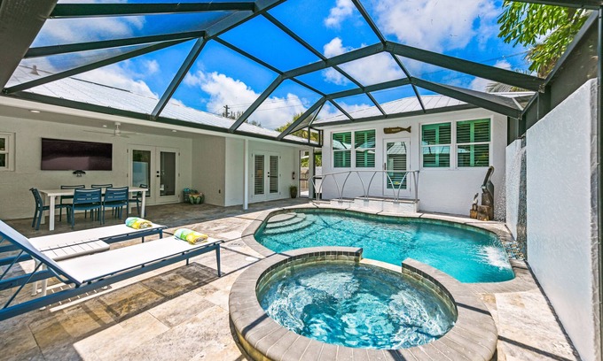 Bay Isle House | REMODELED, Heated Pool and Spa, POOL Table, games, bikes included!