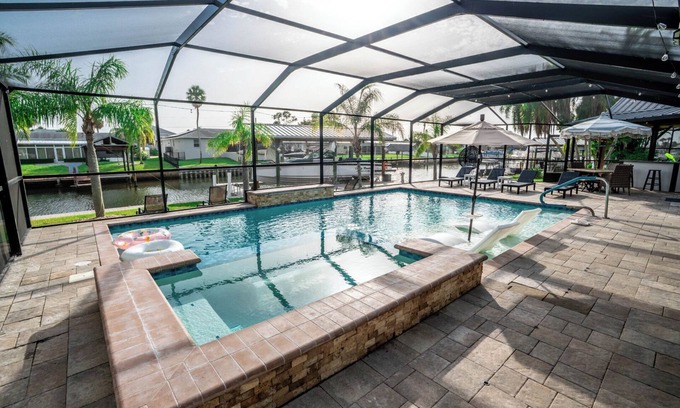 Apollo Beach House | Resort-Style Canal Home w/Pool & Putting Green - Baywatch