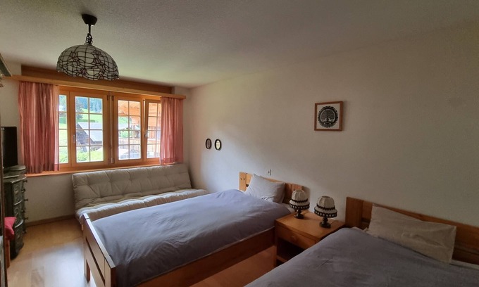 Lauenen Bed & Breakfast | Room with extra-large double-bed, cable TV, private bathroom, organic breakfast,