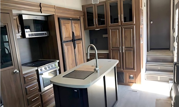 Kenora Resort | RV 5 Rustic Charm w/Queen Bed with Forest Background