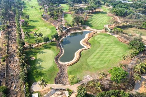 Kodalagurki Villa | SaffronStays Niranta- 4-BDR villa on golf course near Bangalore