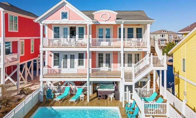 Holden Beach House | "Salty Pink Flamingo" is a stunning 6-bedroom, 4-bathroom oceanfront retreat with a private pool, hot tub, and elevator.