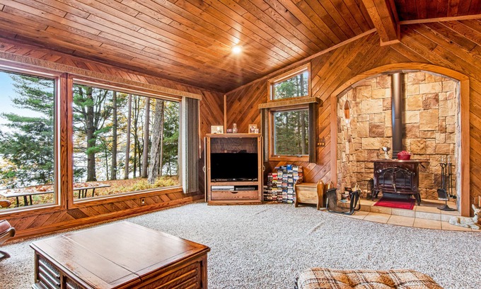 Lac du Flambeau House | Secluded lakefront home with kayaks, canoe, swim platform, firepit, & W/D