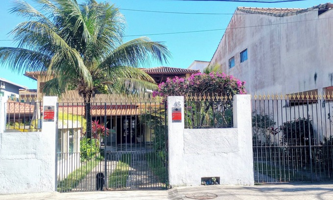 Rio das Ostras House | Single-story linear house with swimming pool in Atlântico.