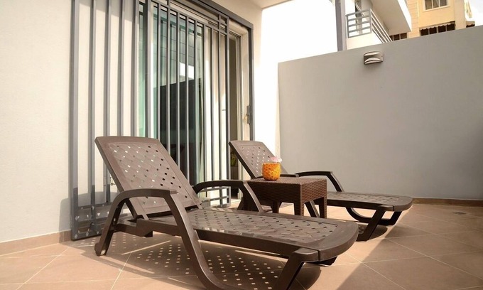 Ensanche Naco Apartment | Sleek,Bright Condo with City-View Terrace –Work & Play in Naco, Santo Domingo!