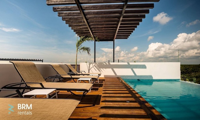 Zama Condo | Sleeps 5. Rooftop infinity pool, 2 bed, 2.5 baths, 2nd floor