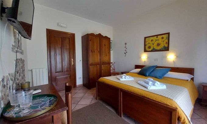 Villagonia Apartment | Sole Mare Giardini Naxos Room 'Girasole' with Balcony, Wi-Fi and Air Conditioning