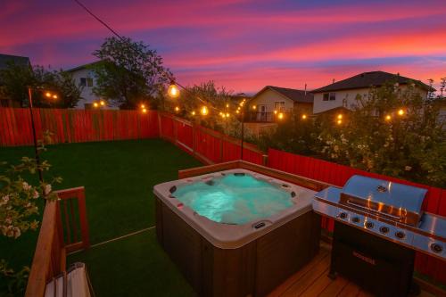 Southeast Edmonton Villa | Spa Oasis Home - Hot Tub - King Bed - BBQ - Garage - Pets!