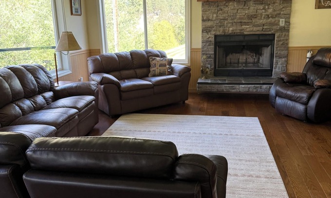 Superior House | Spacious 5 bedroom Riverfront Retreat Hot Tub, Sauna & Family Fun, WiFi & More!
