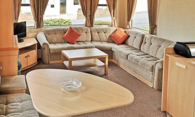 Llanllwchaiarn House | Spacious and comfortable 12ft-wide caravan with one double and two twin.