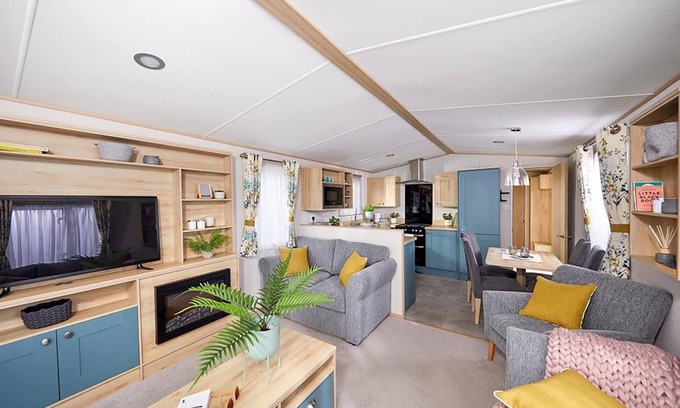 Llanllwchaiarn House | Spacious and modern 12ft-wide caravan with one double and two twin.