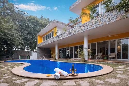 Thanesar Villa | StayVista at The Hideout Farms with Lawn and private Pool