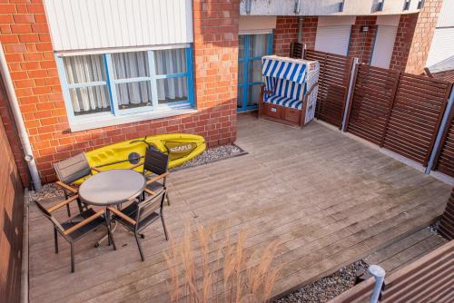 Schonberger Strand Apartment | Strandwohnung mit großer Terrasse in erster Reihe am Schönberger Strand, Kajak, Wallbox, 24h self check-in, DisneyPlus