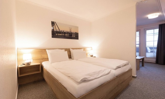Dorumer Neufeld Apartment | Studio 121. With balcony and stylishly furnished.