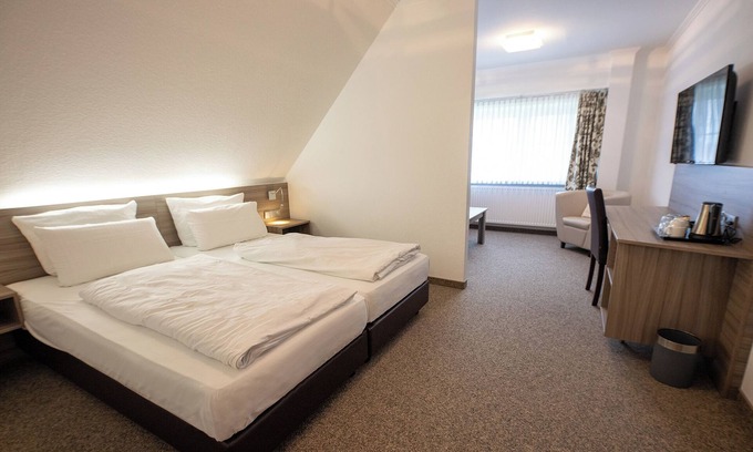 Dorumer Neufeld Apartment | Studio 203. Bright interior and garden view.