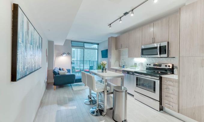 Aurora Highlands Condo | Stunning Highrise w/private Rooftop Ideal Location