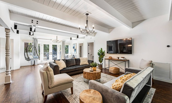 Cedar Glen House | Stunning lakehouse lodge with a deck, fireplace, lush patio & lake access