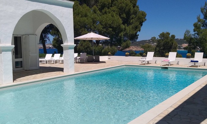 Sant Josep de sa Talaia Villa | Stylish villa, amazing sea views, 15m pool & chill out, private 4100m2 gardens