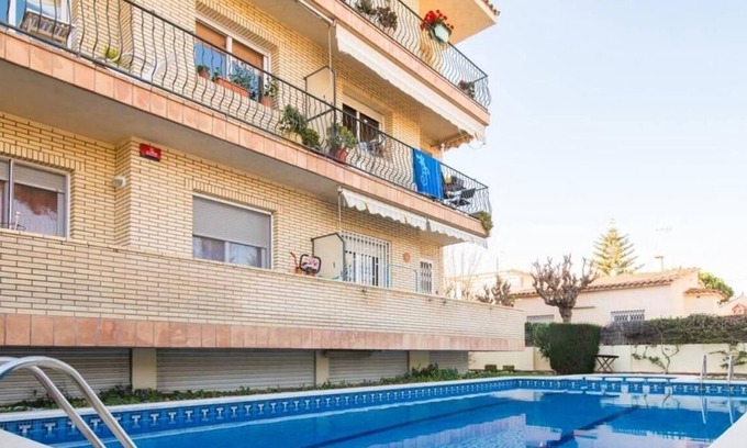 Castelldefels Apartment | Sunny apartment close to the beach with Pool, Garden, Terrace, Balcony, A/C & Wi-Fi