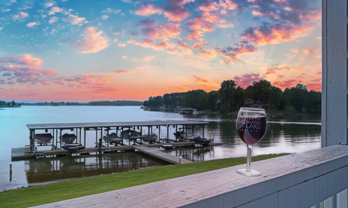 Huddleston House | Sunset Cove - Waterways lakefront retreat with boat slip, pool & beach - dogs OK