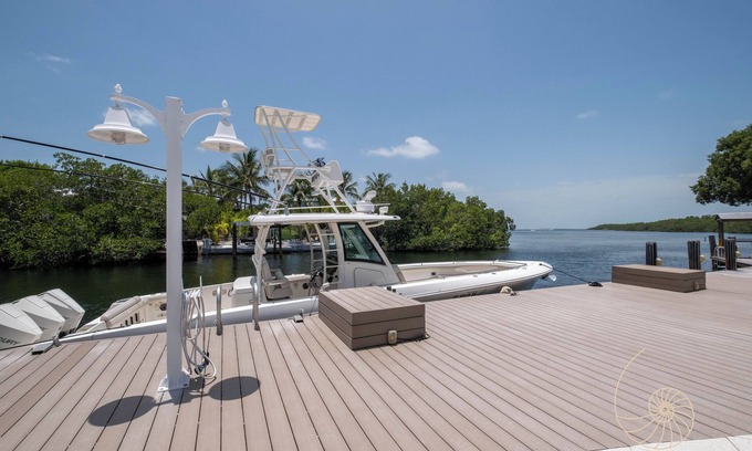 Sunshine Estates Apartment | Sunshine Villa | Bayfront apartment with pool, dockage, and sunsets!