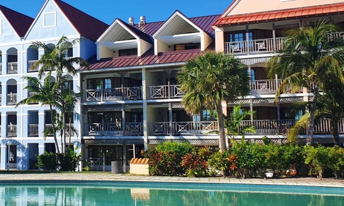 Greening Glade Resort | Taino Beach Bahamas 1 or 2 bedroom suite poolside with covered patio and beach