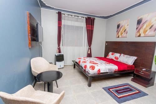 Soroti Apartment | The Den Soroti Red & White