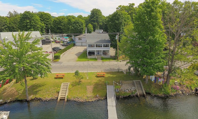 Winchester Apartment | The Inn at Highland Lake, 1st Floor, waterfront yard with a boat dock