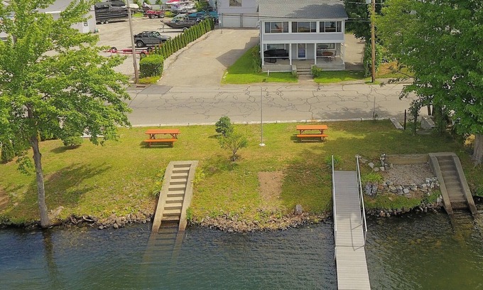 Winchester Apartment | The Inn at Highland Lake, 2nd Floor, waterfront yard with a boat dock