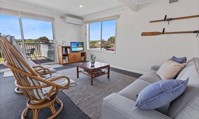 Paynesville House | The Lake Villa - Enjoy views over the treetops of downtown as you relax