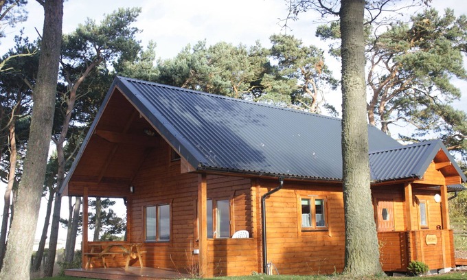 Tain Cabin | The lodge offers stunning views West to Ben Wyvis and North to the hills and mountains of East Suthe