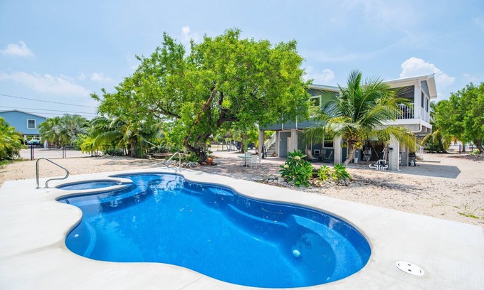 Breezeswept Beach Estates House | The Orchid House, 5 bed/2bath Canal Front Home, Ramrod Key