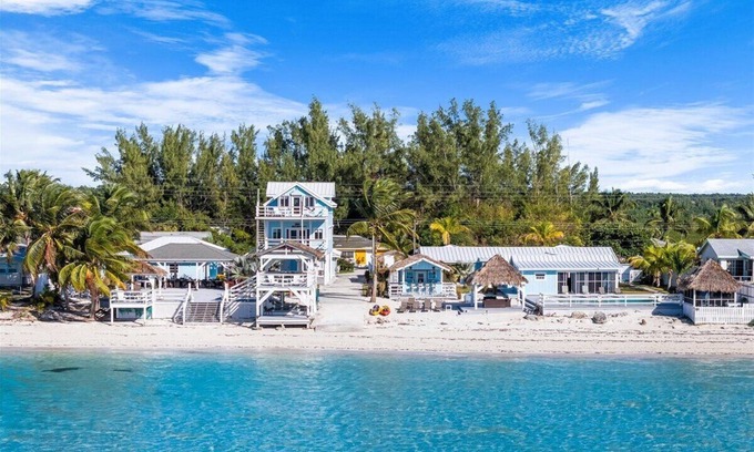 Bahama Palm Shores House | The Paradise. Beachfront property with a pool; accommodates 14 guests.