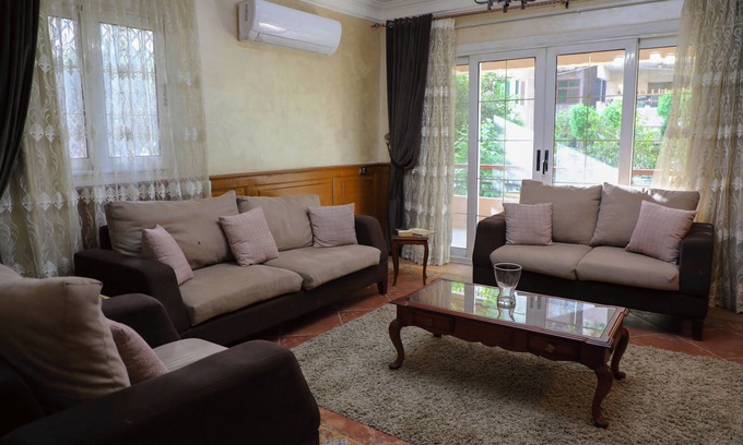 Nasr City Villa | The villa has 3 bedrooms,3 bathrooms,a dining area, and a patio with garden view