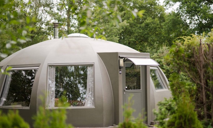 Municipality of Alphen-Chaam House | These detached bungalows with domed roofs are scattered in a wooded resort.