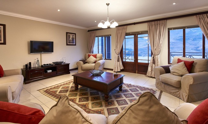 Clarens House | This holiday home has a balcony, stove top and kitchen