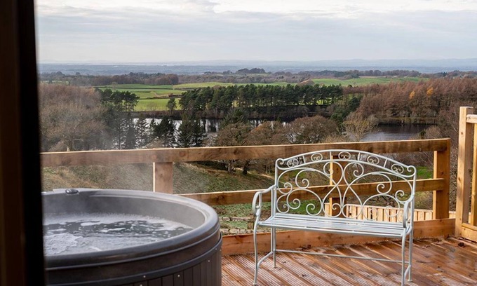 Castle Carrock Cottage | This luxury lodge has its own decking with hot tub