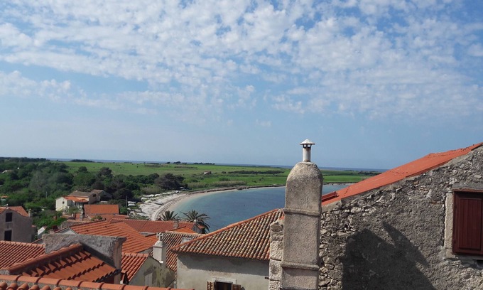 Unije House | This villa comes with a living room and a fully equipped kitchen.